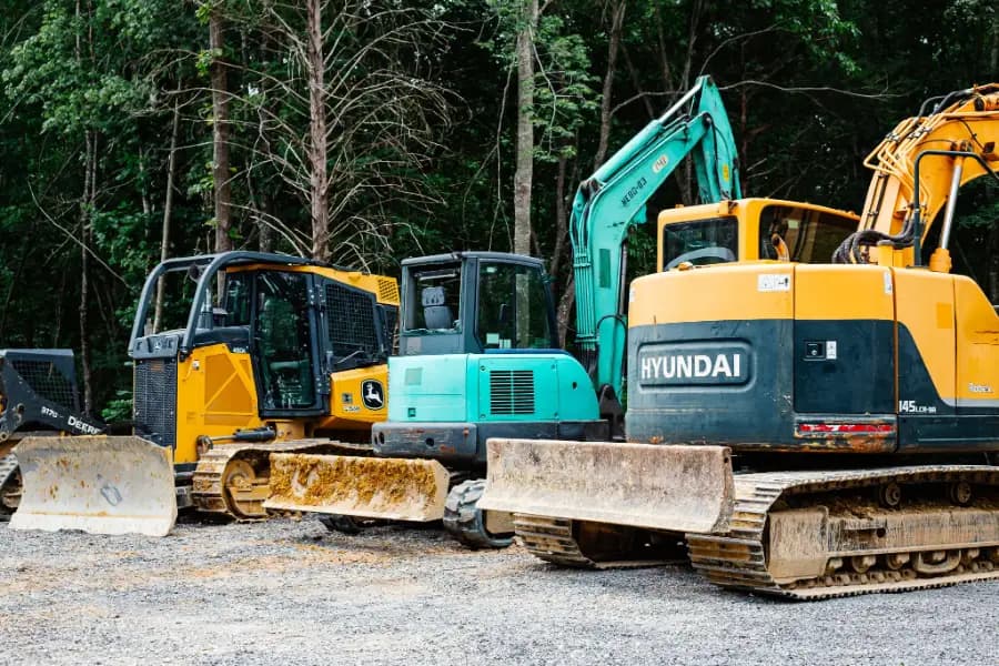 Excavators and loaders staged at the Morgan's Concrete yard