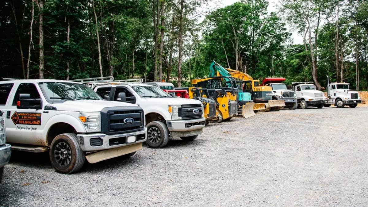 Morgan's trucks and equipment lined up at the yard